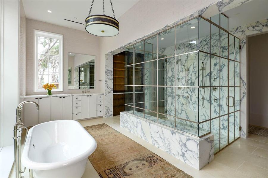 Primary bathroom with separate vantities and two water closets