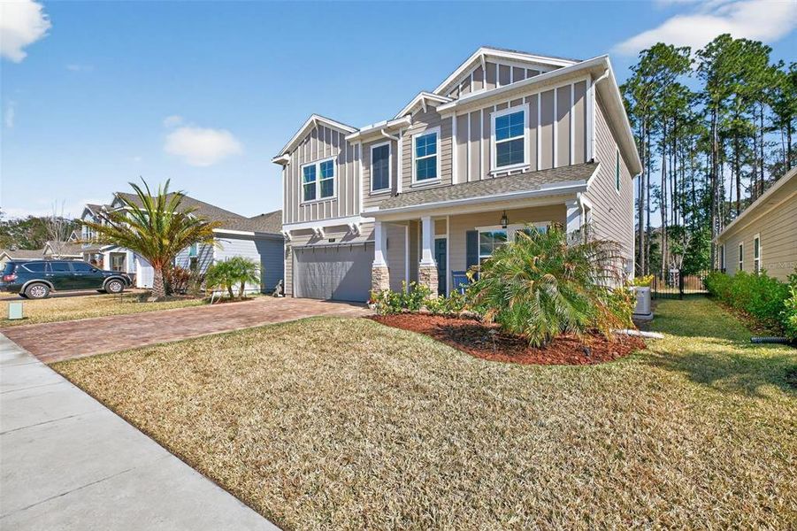Front exterior of a new home in Trailmark, St. Augustine, FL, highlighting curb appeal (Image 24).
