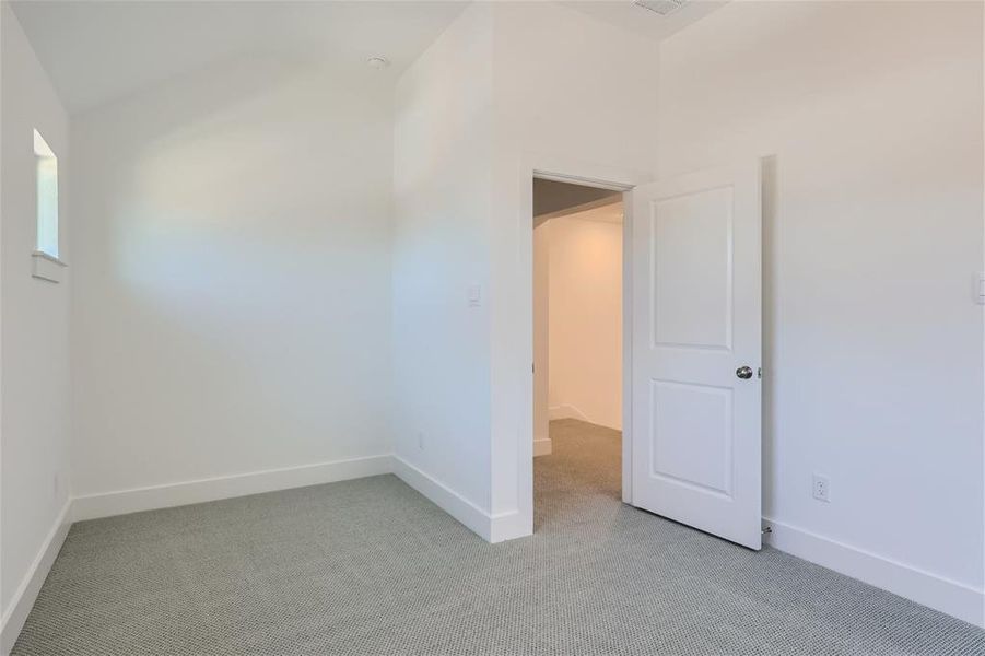 Empty room featuring carpet flooring