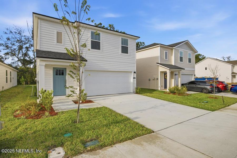Front exterior of a new home in Kings Preserve, Jacksonville, FL, highlighting curb appeal (Image 23).