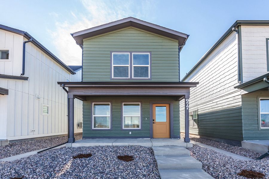 Front exterior of a new home in Prairie Song, Windsor, CO, highlighting curb appeal (Image 2). Front exterior of a new home in Prairie Song, Windsor, CO, highlighting curb appeal (Image 2).
