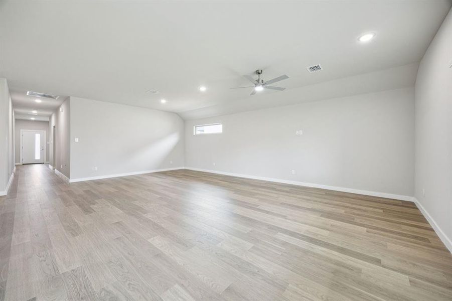 Dining and Living Room in the Hayden home plan by Trophy Signature Homes – REPRESENTATIVE PHOTO