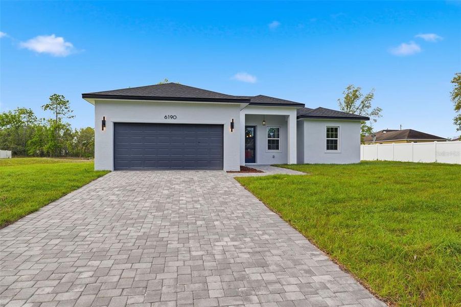 Front exterior of a new home in , Ocala, FL, highlighting curb appeal (Image 19).
