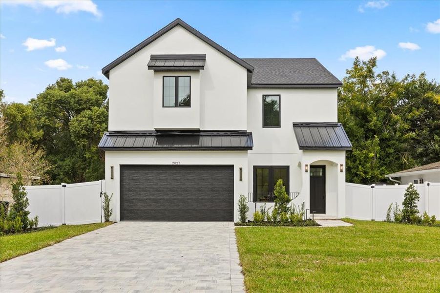 Front exterior of a new home in , Orlando, FL, highlighting curb appeal (Image 1). Front exterior of a new home in , Orlando, FL, highlighting curb appeal (Image 1).