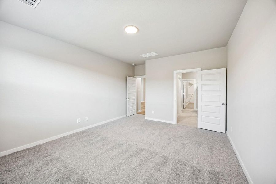 Primary Suite in the Willow home plan by Trophy Signature Homes – REPRESENTATIVE PHOTO Primary Suite in the Willow home plan by Trophy Signature Homes – REPRESENTATIVE PHOTO