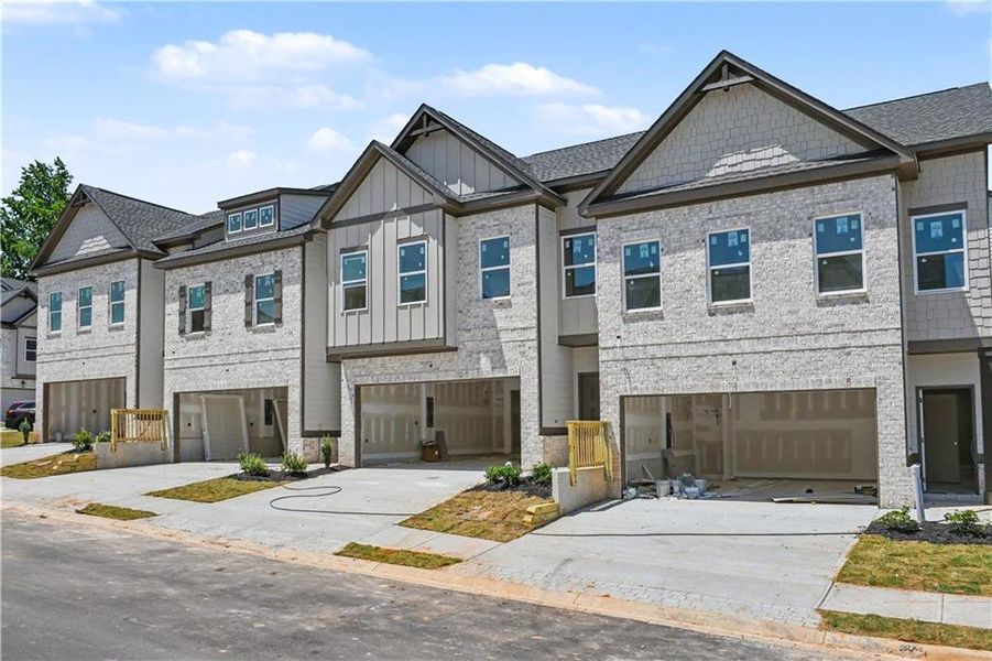 Front exterior of a new home in , Norcross, GA, highlighting curb appeal (Image 1). Front exterior of a new home in , Norcross, GA, highlighting curb appeal (Image 1).