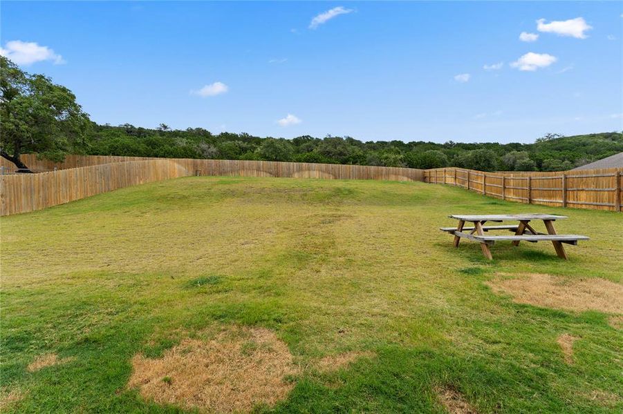 View of fenced backyard