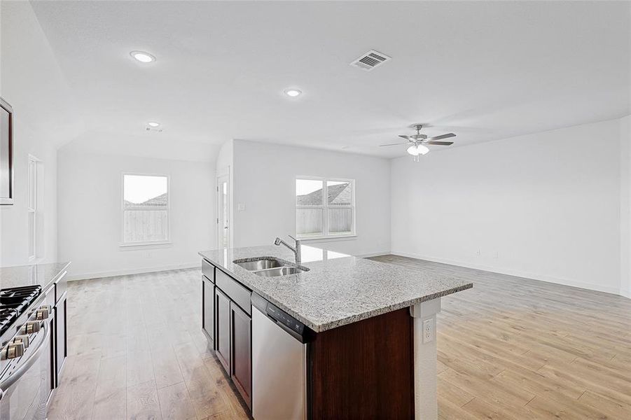 Kitchen featuring sink, light hardwood / wood-style flooring, a healthy amount of sunlight, and appliances with stainless steel finishes