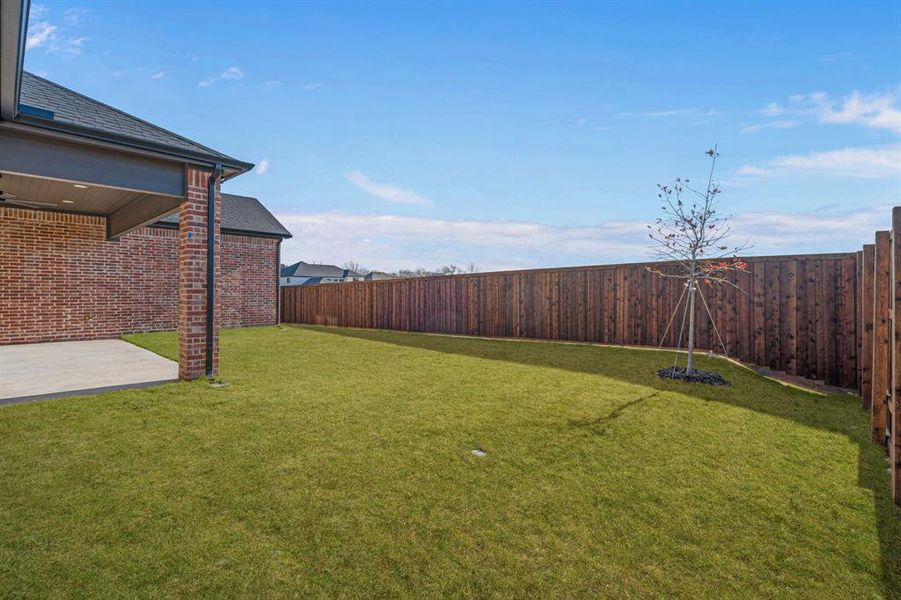 Exterior details and patio area of a home in The Grove, North Richland Hills (Image 4).