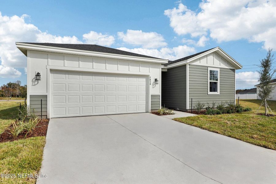 Front exterior of a new home in Cypress Meadows - Signature Series, Jacksonville, FL, highlighting curb appeal (Image 22).