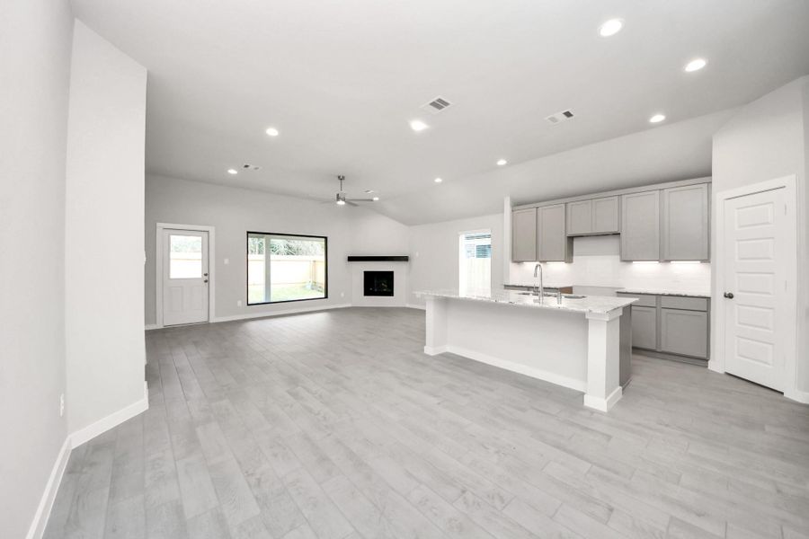 Make memories gathered around the table with your family and friends! This spacious dining room features elegant flooring, custom paint, and adjacent to family room and kitchen for open concept feel. Sample photo of completed home with similar floor plan. Actual colors and selections may vary. Make memories gathered around the table with your family and friends! This spacious dining room features elegant flooring, custom paint, and adjacent to family room and kitchen for open concept feel. Sample photo of completed home with similar floor plan. Actual colors and selections may vary.