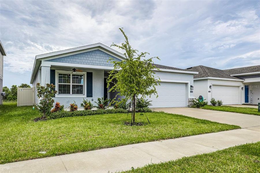 Front exterior of a new home in , Winter Haven, FL, highlighting curb appeal (Image 2). Front exterior of a new home in , Winter Haven, FL, highlighting curb appeal (Image 2).