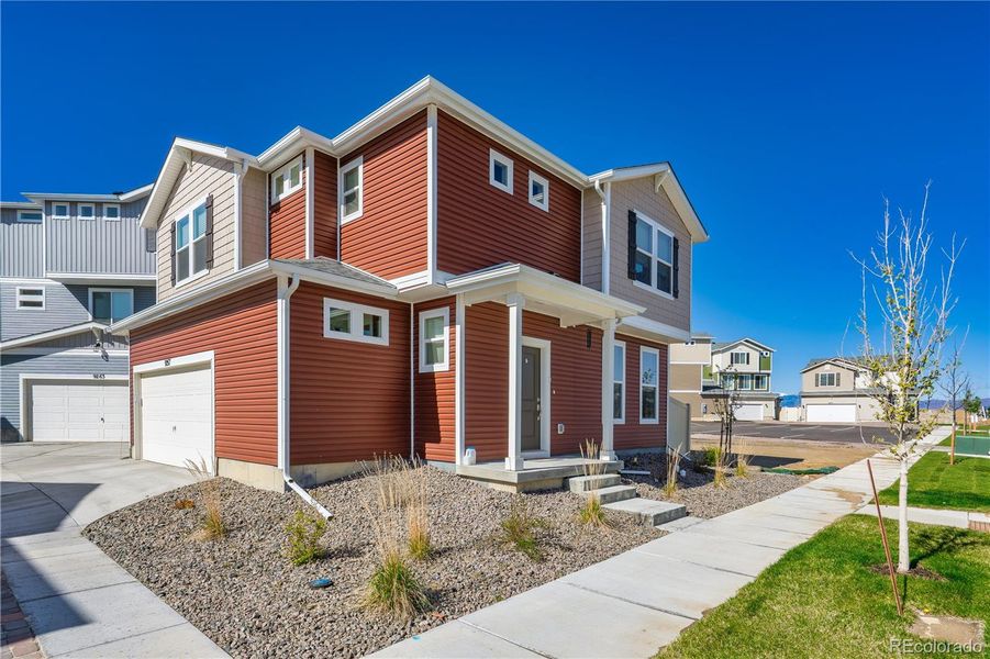 Front exterior of a new home in , Colorado Springs, CO, highlighting curb appeal (Image 19).