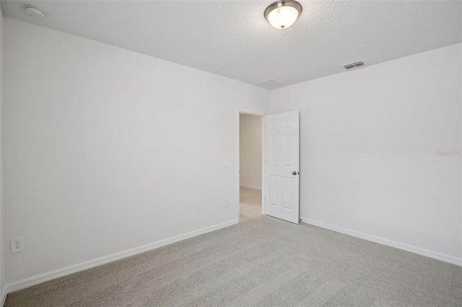 Spacious, unfurnished interior of a new home in Villamar - Signature Series, Winter Haven (Image 26).