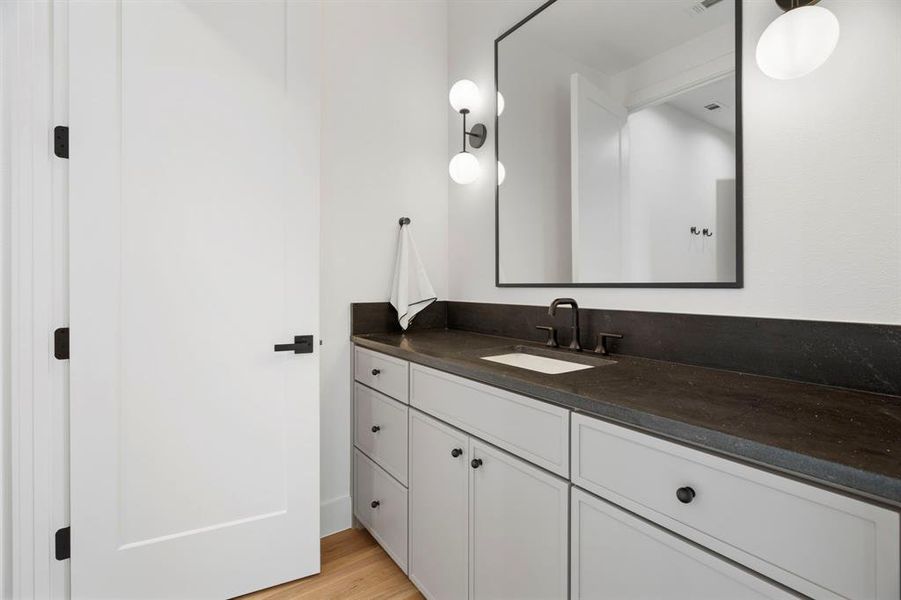 Bathroom with vanity and light wood finished floors Bathroom with vanity and light wood finished floors