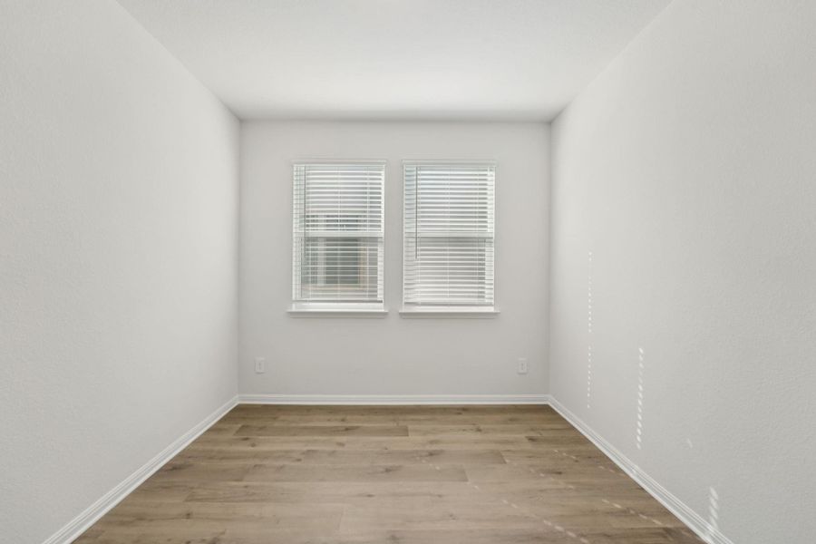 Unfurnished room featuring light wood-style flooring and baseboards