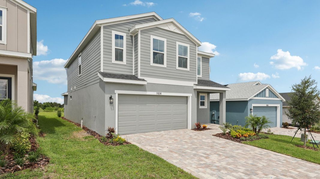 Representative exterior photo of a completed home built from the Naples by DRB Homes in Hamilton Bluff, Haines City, FL (Image 6).