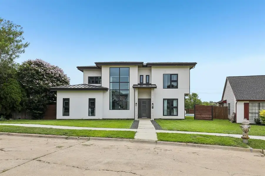 Front exterior of a new home in , The Colony, TX, highlighting curb appeal (Image 1). Front exterior of a new home in , The Colony, TX, highlighting curb appeal (Image 1).