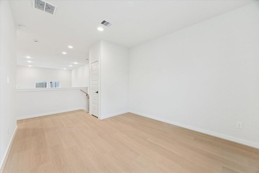 Alternate view of the third-floor game room showcasing open floor space and versatile design, ideal for games, lounging, or creative activities