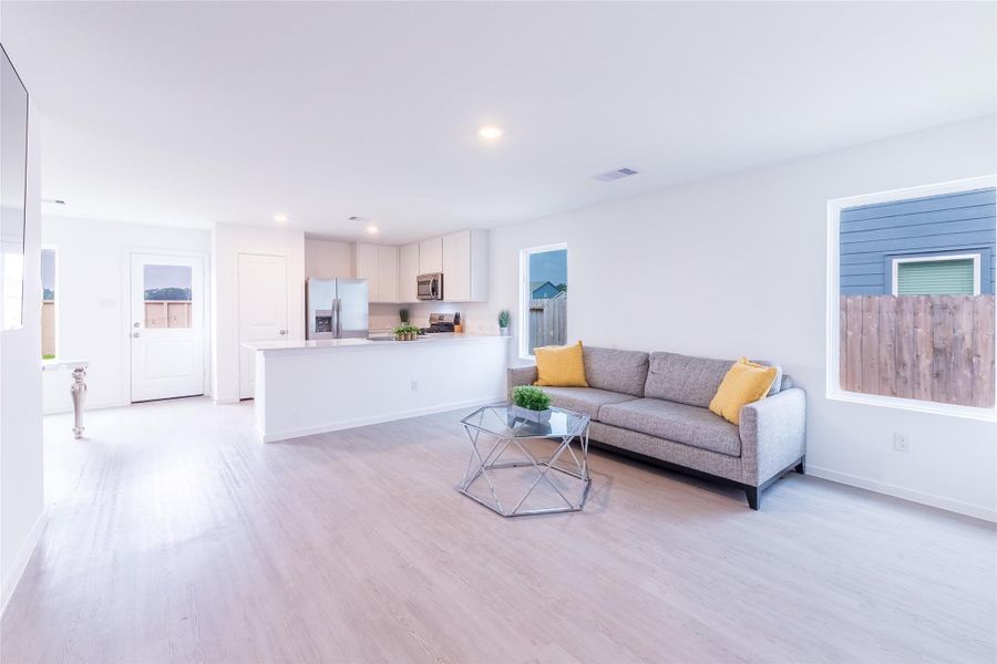 The kitchen is open to the living and dining rooms. This is ideal for entertaining. The kitchen is open to the living and dining rooms. This is ideal for entertaining.