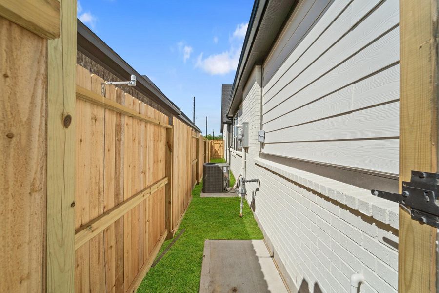 Front exterior of a new home in Riceland, Mont Belvieu, TX, highlighting curb appeal (Image 11).