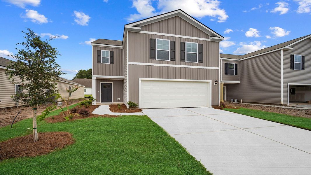 Front exterior of a new home in Rice Hope, Port Wentworth, GA, highlighting curb appeal (Image 24). Front exterior of a new home in Rice Hope, Port Wentworth, GA, highlighting curb appeal (Image 24).