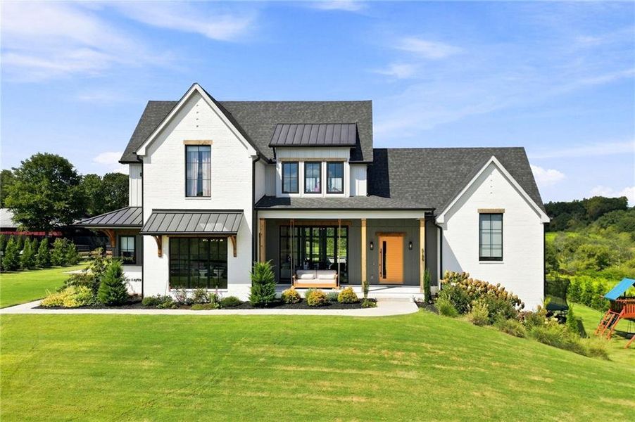 Front exterior of a new home in , Cumming, GA, highlighting curb appeal (Image 1). Front exterior of a new home in , Cumming, GA, highlighting curb appeal (Image 1).