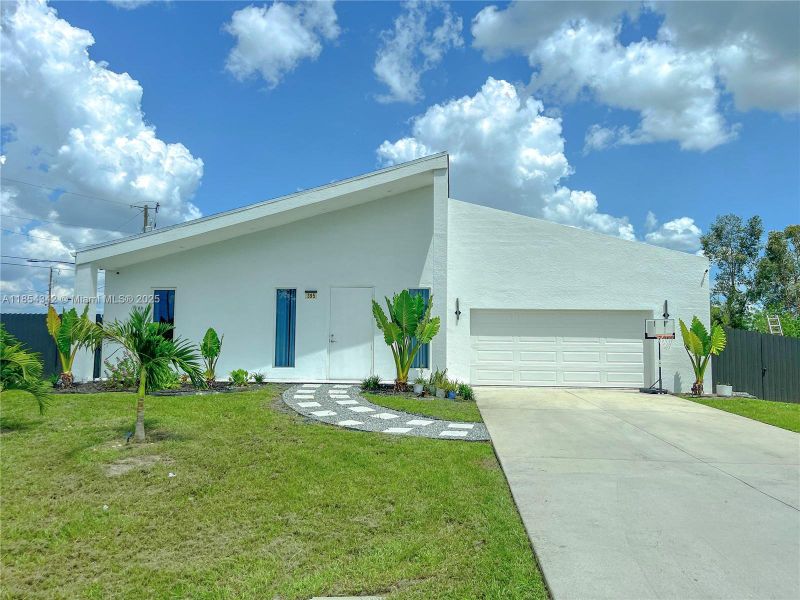 Front exterior of a new home in , Lehigh Acres, FL, highlighting curb appeal (Image 18). Front exterior of a new home in , Lehigh Acres, FL, highlighting curb appeal (Image 18).
