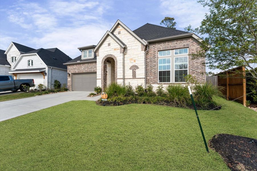 Front exterior of a new home in , Tomball, TX, highlighting curb appeal (Image 21).