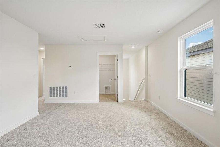 Spacious, unfurnished interior of a new home in Grasslands West, Lakeland (Image 36).