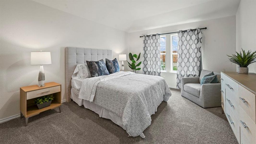 Carpeted bedroom with baseboards Carpeted bedroom with baseboards