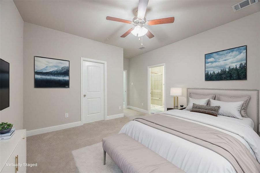 Carpeted bedroom featuring ceiling fan and ensuite bathroom