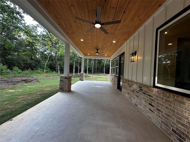 Covered back porch with upgraded tile flooring