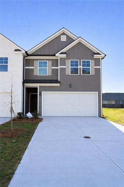 Front exterior of a new home in Rivershire Place, Villa Rica, GA, highlighting curb appeal (Image 1). Front exterior of a new home in Rivershire Place, Villa Rica, GA, highlighting curb appeal (Image 1).