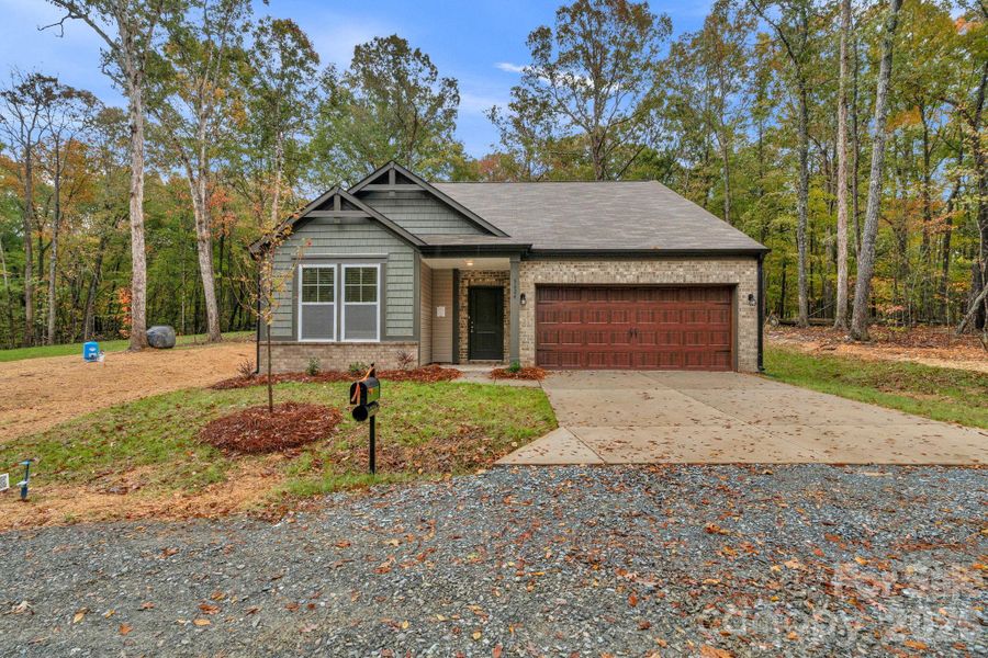 Front exterior of a new home in , Monroe, NC, highlighting curb appeal (Image 21).