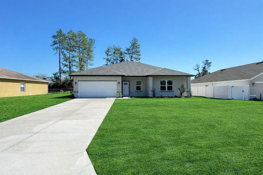 Front exterior of a new home in , Ocala, FL, highlighting curb appeal (Image 25).