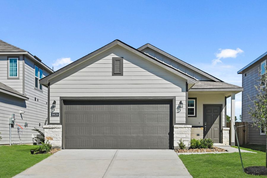 Front exterior of a new home in Northpark South, Porter, TX, highlighting curb appeal (Image 2). Front exterior of a new home in Northpark South, Porter, TX, highlighting curb appeal (Image 2).