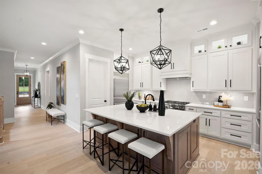 Lower cabinets in front of bar stools for wonderful storage!