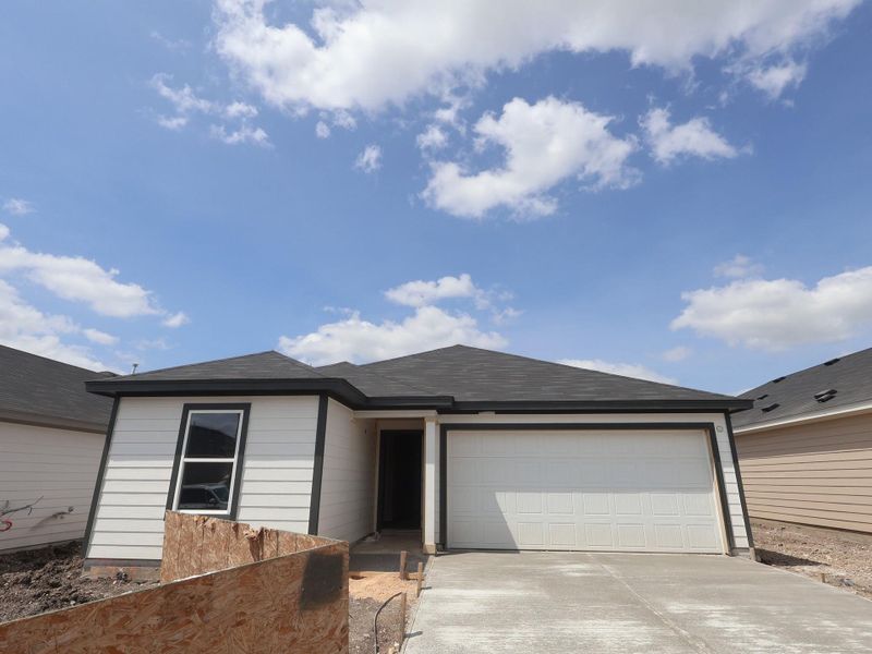 Front exterior of a new home in Marble Creek Crossing, Austin, TX, highlighting curb appeal (Image 1). Front exterior of a new home in Marble Creek Crossing, Austin, TX, highlighting curb appeal (Image 1).