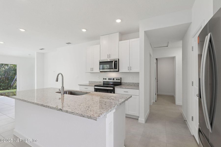 Furnished interior view inside a new home in Flagler Village - Classic Series, Palm Coast (Image 12).