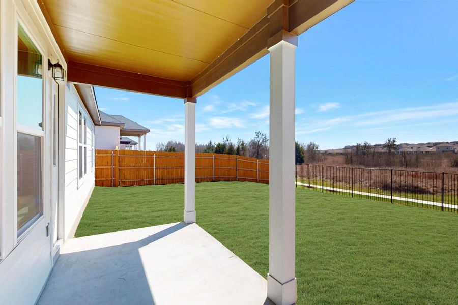 Exterior details and patio area of a home in Carillon, Manor (Image 3).