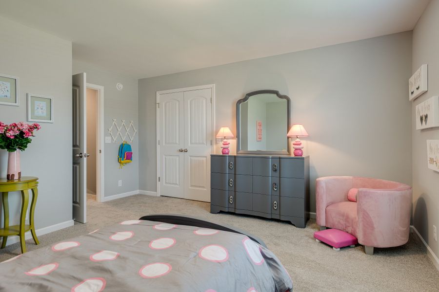 Secondary Bedroom upstairs with a HUGE closet & attic storage space!