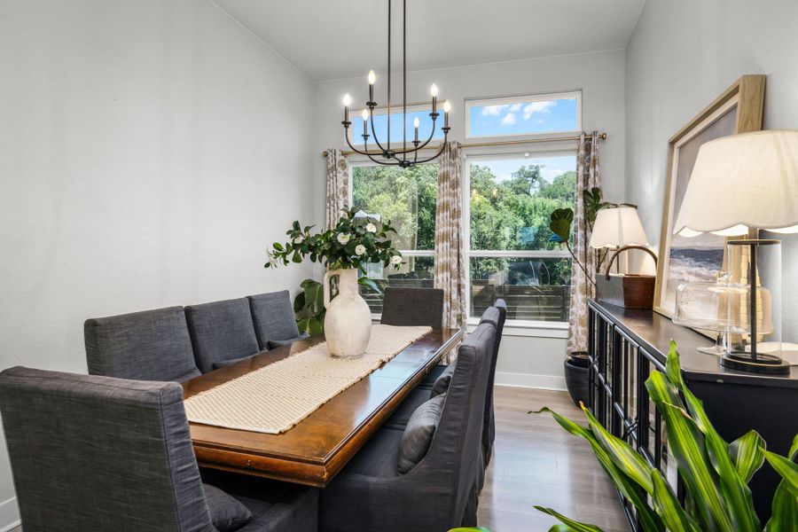 A refined dining space with ample natural light, ideal for gatherings.