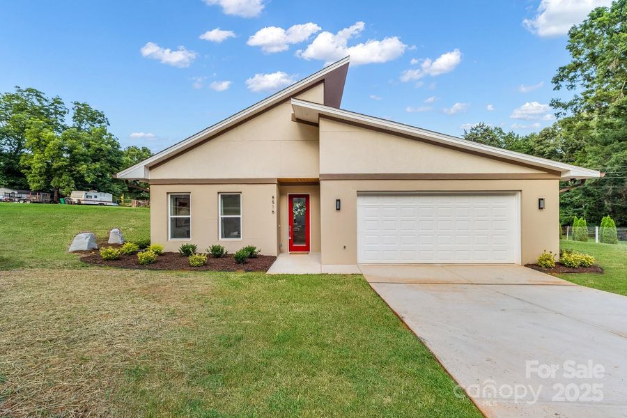 Front exterior of a new home in , Charlotte, NC, highlighting curb appeal (Image 1).