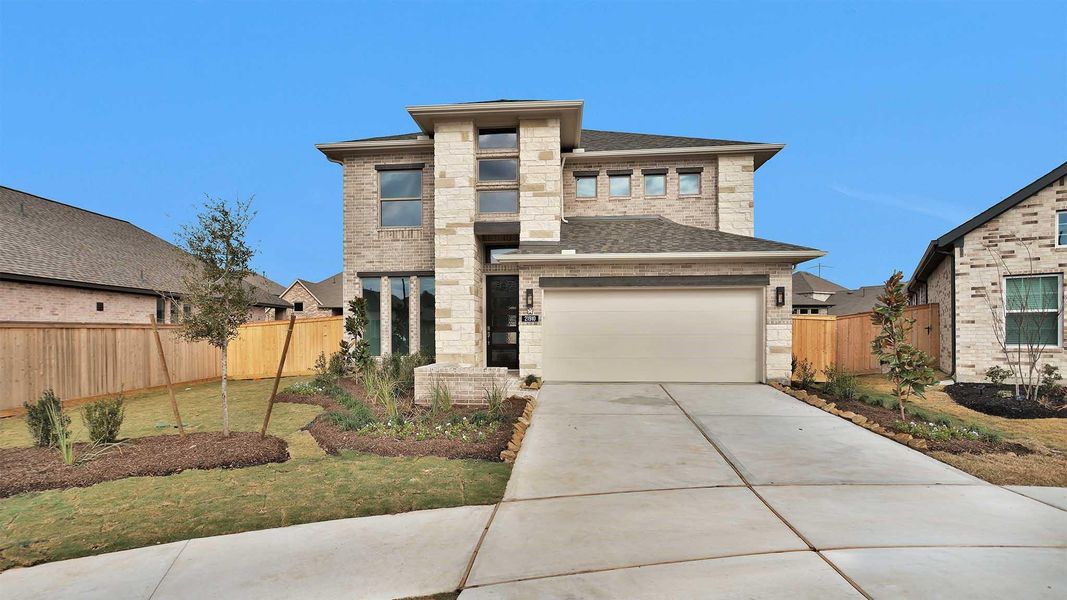 Front exterior of a new home in Bridgeland, Cypress, TX, highlighting curb appeal (Image 2).