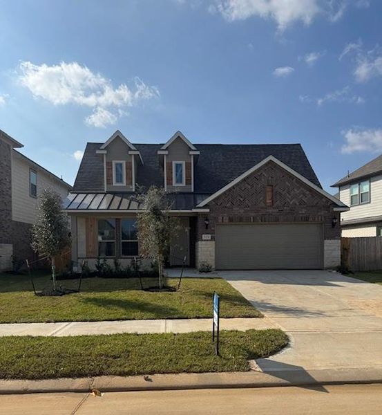 Front exterior of a new home in Stone Creek Ranch, Hockley, TX, highlighting curb appeal (Image 2). Front exterior of a new home in Stone Creek Ranch, Hockley, TX, highlighting curb appeal (Image 2).