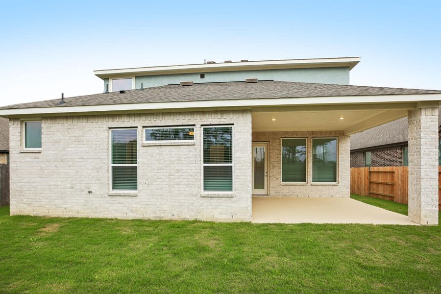 Exterior details and patio area of a home in The Trails, New Caney (Image 4).