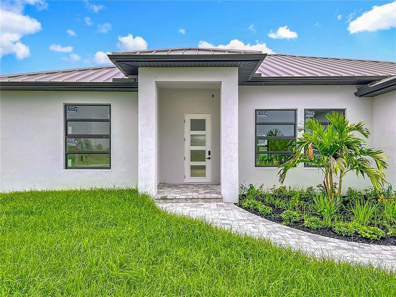 Front exterior of a new home in , Placida, FL, highlighting curb appeal (Image 27). Front exterior of a new home in , Placida, FL, highlighting curb appeal (Image 27).