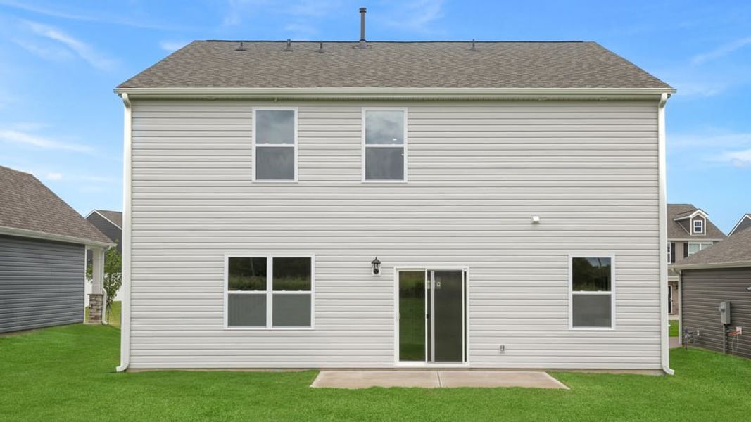 Exterior details and patio area of a home in Durbin Meadows Traditions, Fountain Inn (Image 3).