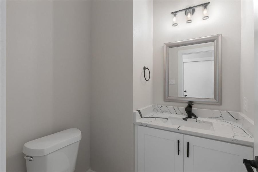 Half bath with toilet and vanity
